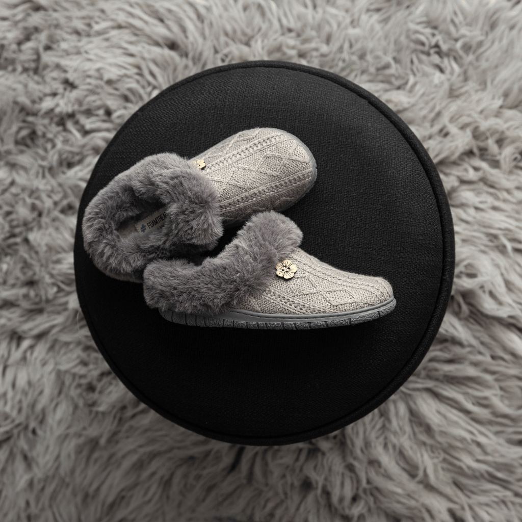Loom Grey slippers on a stool
